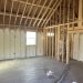 Exposed roof beams inside a building under construction in Central Texas.